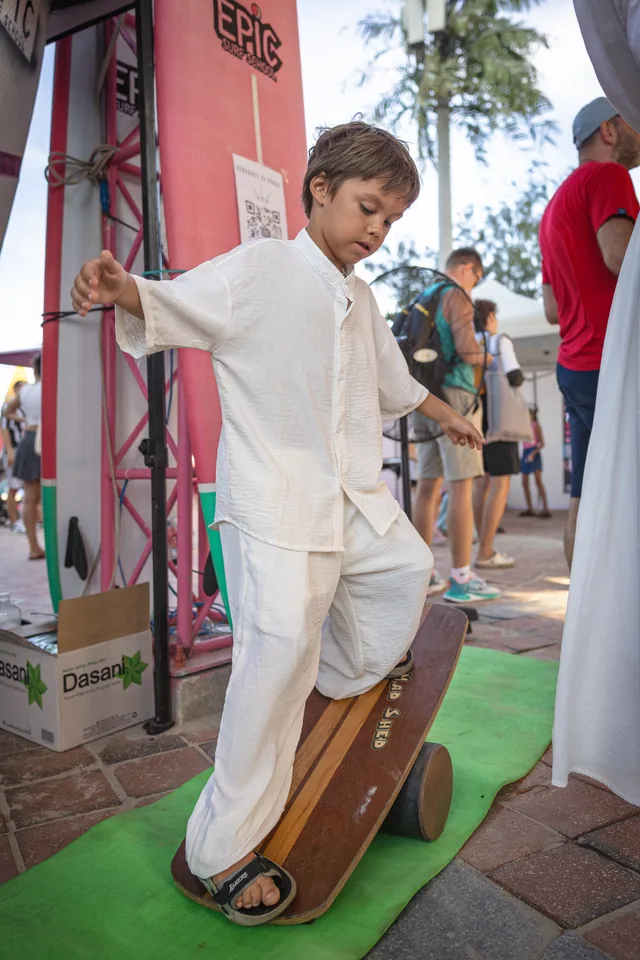 Child practising balance on a balance board